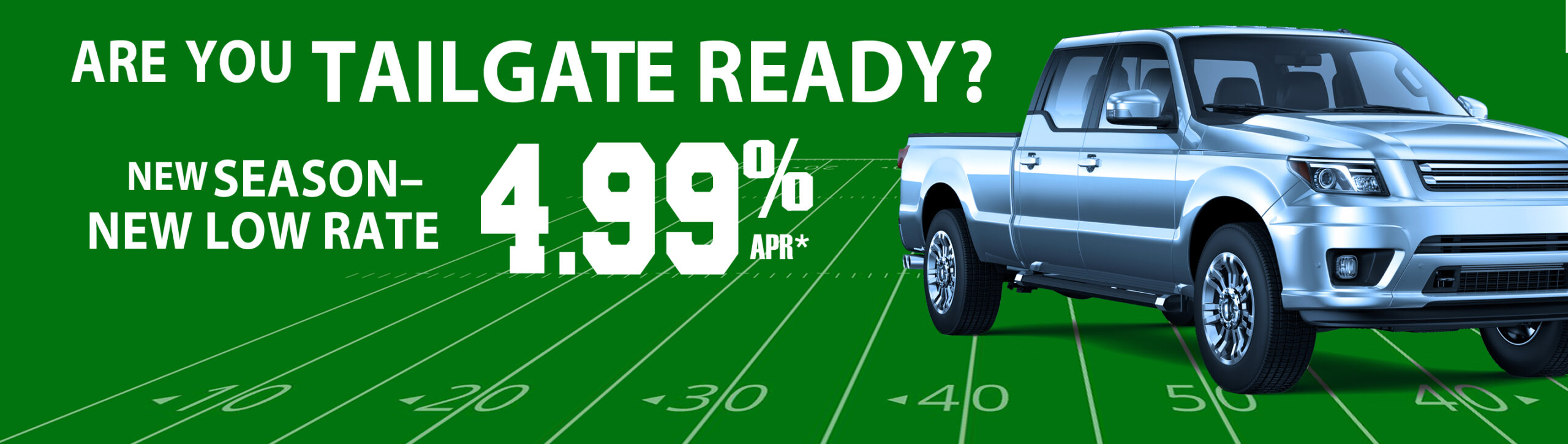 new pickup truck staged on football field. Are you tailgate ready? New season, new low rate. 4.99% apr*