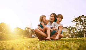 Woman having fun with two boys