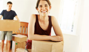 young couple with moving boxes