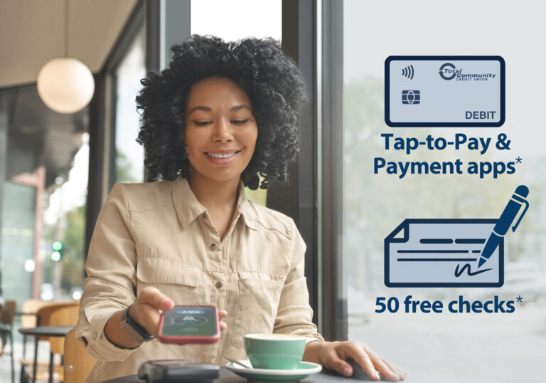 smiling woman using debit car at POS device