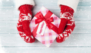 wrapped holiday gift with tag, Happy Holidays