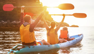family using a kayak